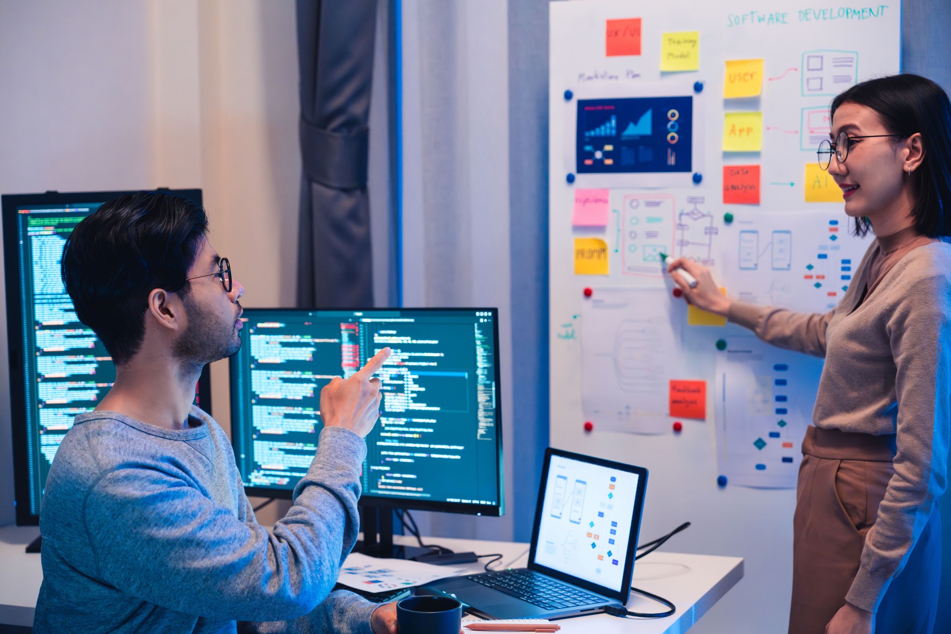 Developer team present project interface design with board and solving problem at office